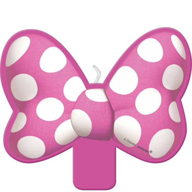 a pink bow with white polka dots on it