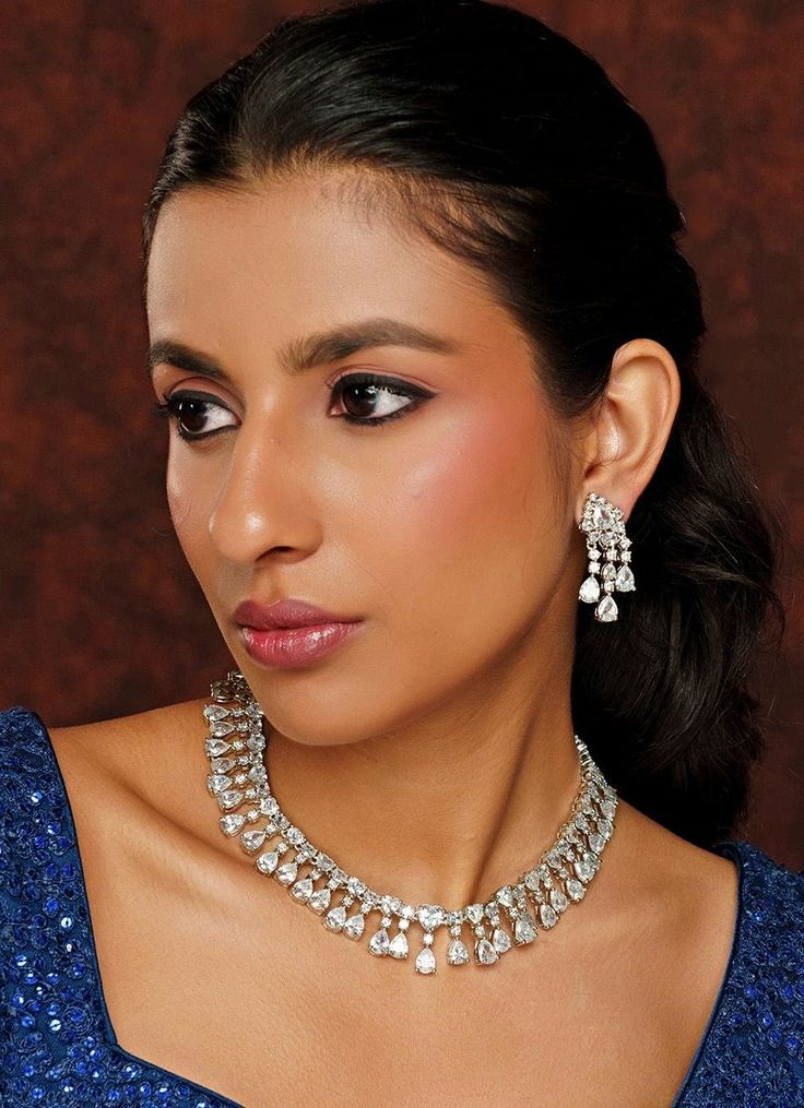 White Finish Drop Diamond Necklace Set Zevar By Geeta - Fabilicious Fashion Party Necklace With Diamond Accents, Dazzling Bridal Necklace For Celebration, Exquisite Party Jewelry With Single Cut Diamonds, Dazzling Silver Jewelry Sets For Festive Season, Elegant Necklace With Diamond Accents For Festive Occasions, Formal White Jewelry Sets With Sparkling Stones, Exquisite Silver Jewelry For Festive Season, Dazzling American Diamond Necklace For Party, Festive Silver Bridal Necklace With Sparkling Stones