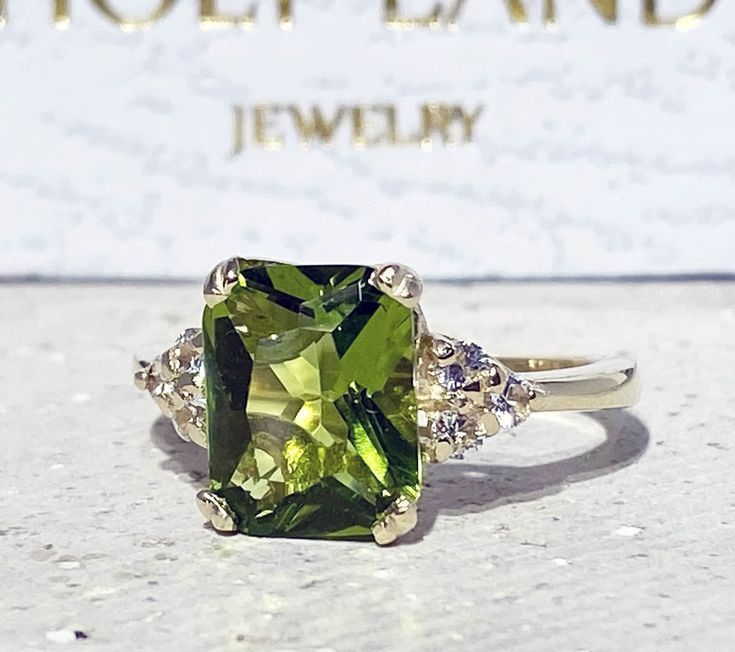 Don't miss this opportunity to own this beautiful gemstone ring crafted in 14k gold filled => Gemstone Type - Peridot, Clear Quartz => Gemstone Cut - Faceted => Gemstone Size - 8*10 mm, 2 mm => Total Number of Gemstones - 7 => Metal Type - 14k Gold Filled (Tarnish Resistant And Nickel Free) - also available in 925 sterling silver * Please contact me for pricing on a sizes larger than 11 * ~ Feel free to ask me about custom made designs. ❏ Replacements and custom orders : ✪ 925 ste Peridot Rings Vintage, Rag Bag, Ring Rectangle, Statement Engagement Ring, Peridot Engagement Rings, Rectangle Ring, Mothers Ring, Prong Ring, Peridot Jewelry