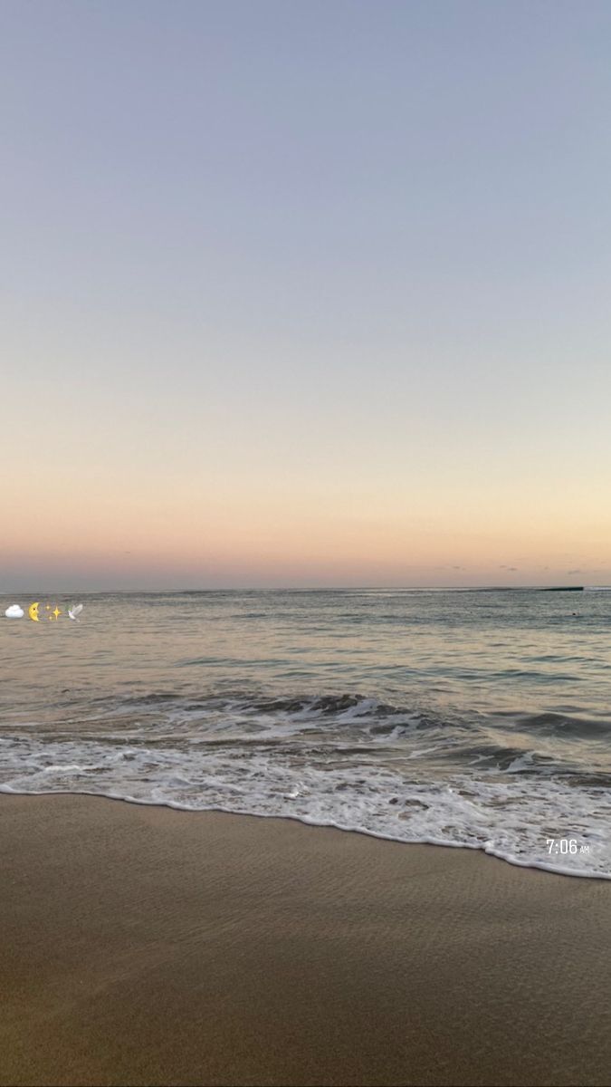 the beach has waves coming in to shore