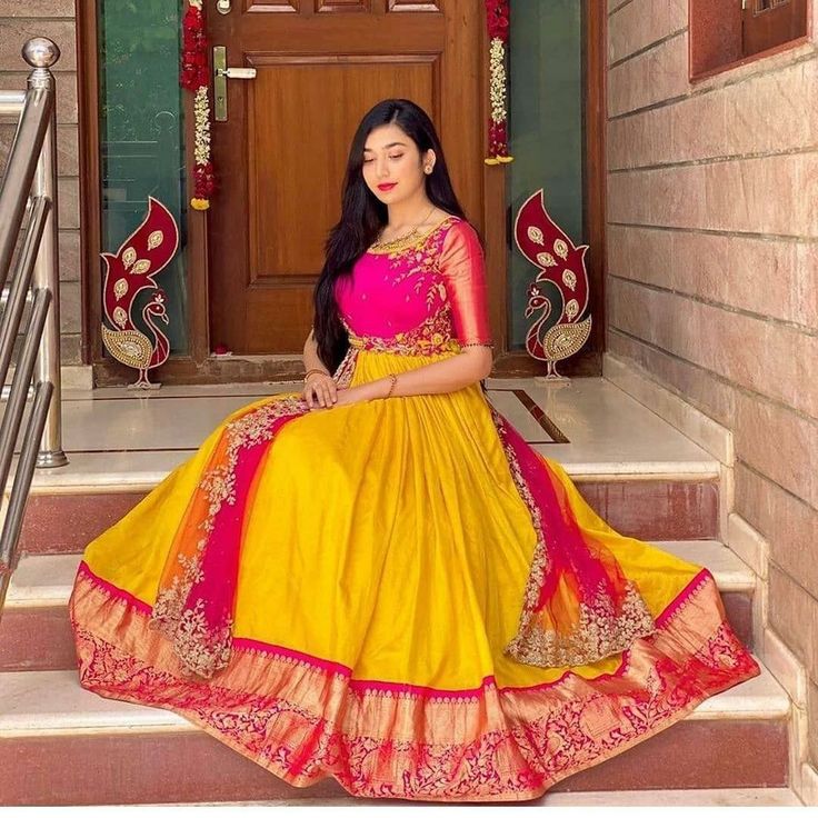 Yellow pink combination Yellow Pink Dress For Haldi, Yellow Pink Combination Saree, Yellow Long Frocks, Pink And Yellow Lehenga, New Long Frock Models, Yellow And Pink Lehenga, Traditional Skirt And Top, Long Frock Models, Rice Ceremony