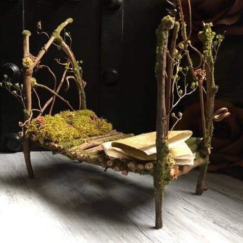 a bed made out of branches and moss