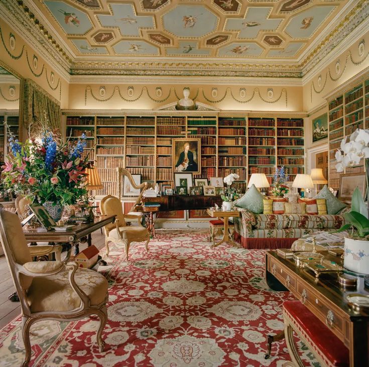 a living room filled with lots of furniture and bookshelves