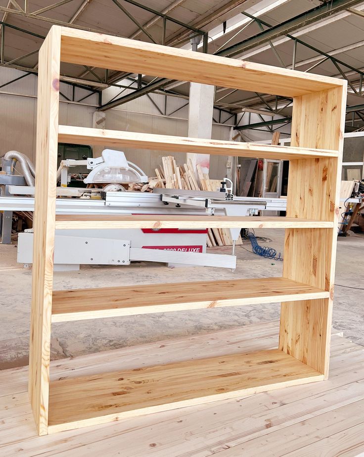 the shelves are made out of plywood and have been built in order to hold woodworking tools