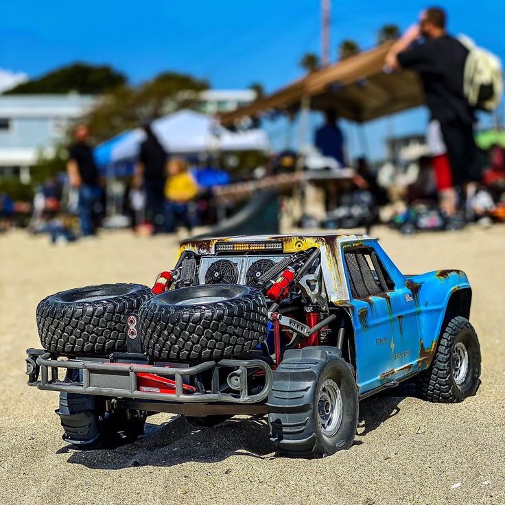 a toy truck with some tires on the back