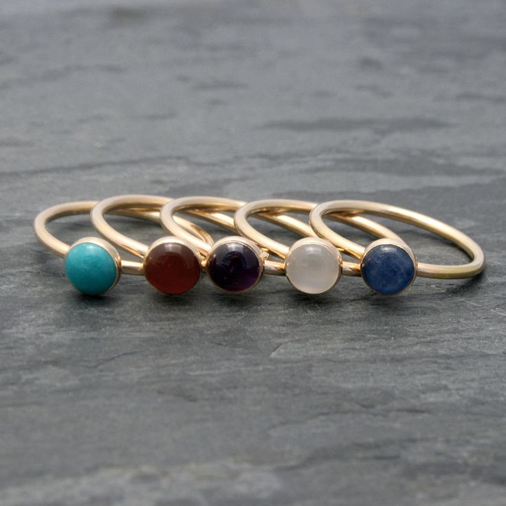 Create your own unique set of stacking rings. Select a stacking ring to represent your birthday or the birthdays of the ones you love. Or, create your own colorful set by mixing and matching your favorite colors and gemstones. The gems are 6mm. Set in 14k Gold-fill. I use durable, high quality 14k gold-fill to make these rings. 14 karat gold-fill has a thick layer of karat gold, not just a microscopic film, as is the case with gold-plated and gold vermeil items. This ring will be made to order i Gold Stackable Gemstones Fine Jewelry, Gold Stackable Gemstones For Fine Jewelry, Adjustable Fine Jewelry Midi Rings With Gemstone, Adjustable Gemstone Midi Rings In Fine Jewelry Style, 14k Gold Rings With Natural Stones For Gift, Stackable Oval Midi Rings For Gift, Stackable Oval Midi Rings As Gift, Adjustable Stackable Moonstone Ring Spiritual, Stackable Oval Midi Rings Gift