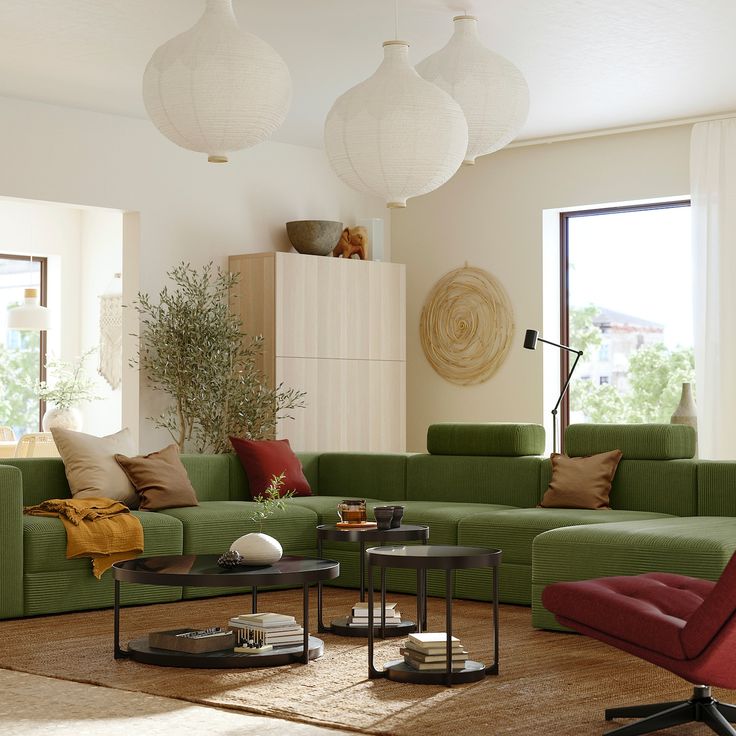 a living room filled with lots of green furniture