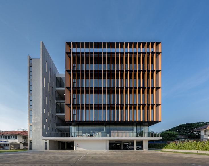 a large building with many windows on the front and side of it's face