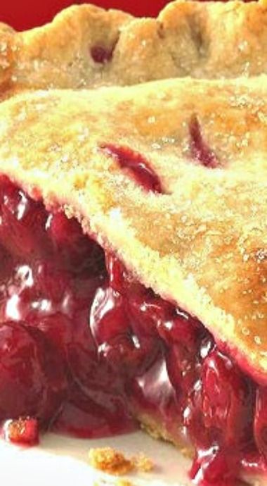 a close up of a pie on a plate with cranberry sauce in it