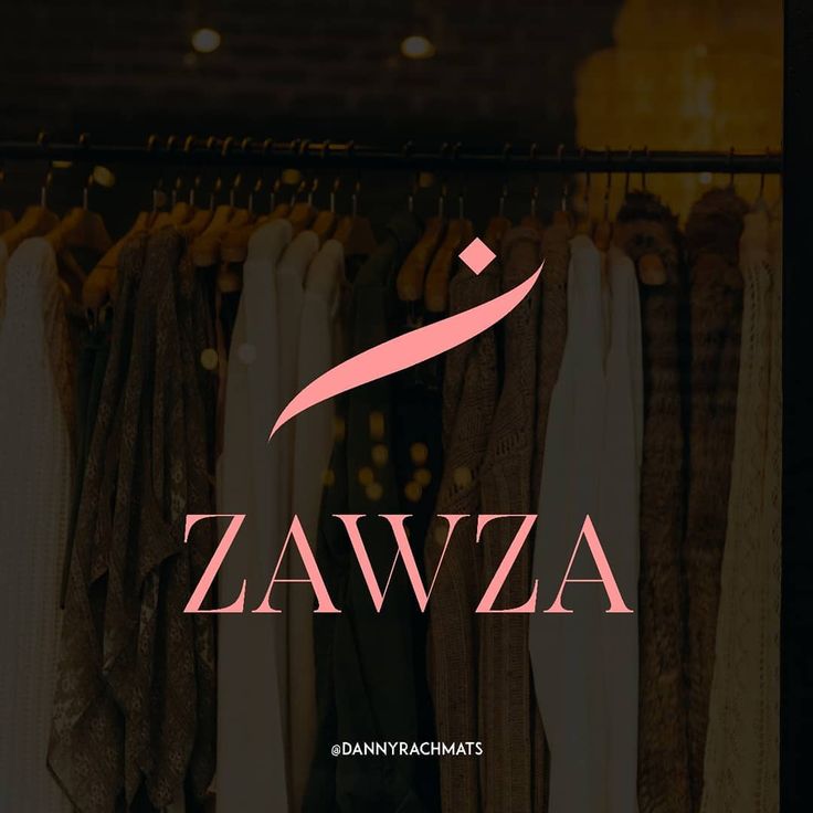 the zawa logo is displayed in front of clothes hanging on racks and against a dark background