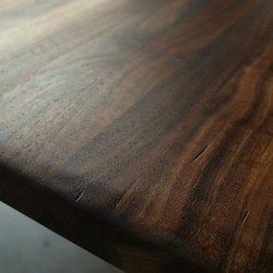 a close up of a wooden table with no one on it or in the background