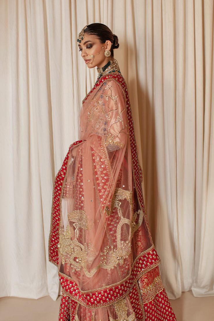 Traditional Pishwas and Dupatta Pakistani Bridal Dress is a traditional attire that gives the gorgeous bride a head-turning appearance at the wedding. Premium quality tissue fabric and luxury designs make this beautiful Pishwas Dress your priority for the big day. Pakistani Bridal Pishwas The Pakistani Bridal Pishwas comes in an alluring red color and is gracefully emblazoned with luxury designs and embellishments work. The bodice and sleeves of this Pishwas Frock come in tissue fabric and it ha Bridal Pishwas, Lehenga For Engagement, Bridal Lehenga Images, Tissue Fabric, Maharani Designer Boutique, Bridal Lehenga Online, Pakistani Bridal Dress, Designer Bridal Lehenga Choli, Bridal Lehenga Designs