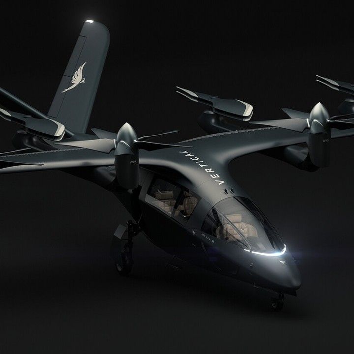 a black and white photo of a small plane with lights on it's wings