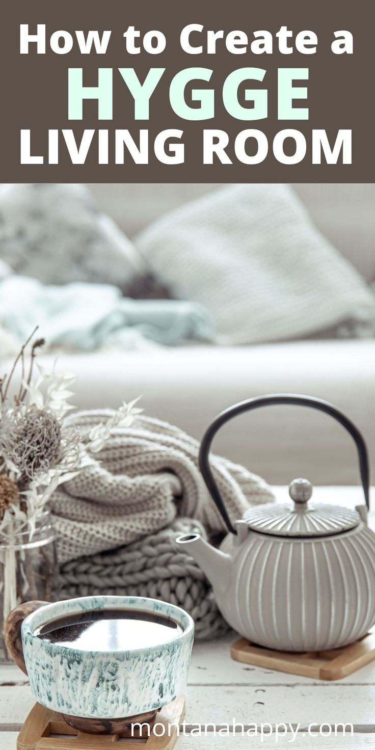 a living room with white furniture and gray accessories on the table, text overlay reads how to create a hygge living room