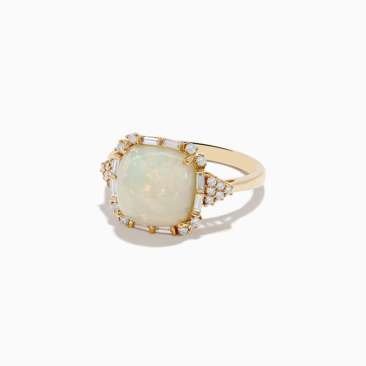 a white opal and diamond ring on a white background with gold trimmings