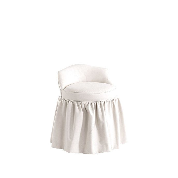 a white chair with a ruffled skirt on it