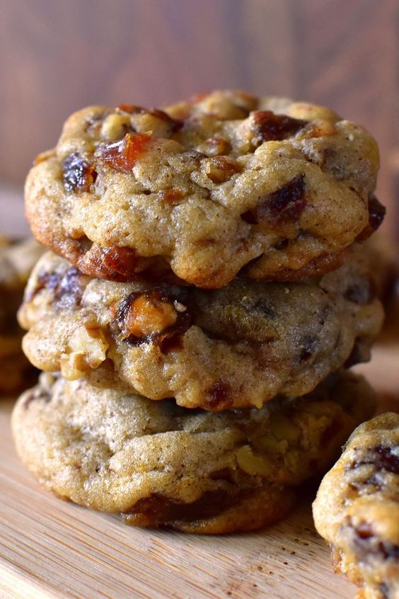 a stack of cookies sitting on top of a wooden table