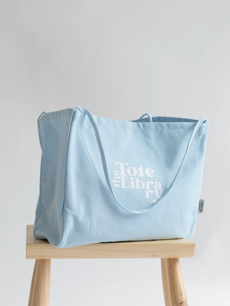 【Product description】 Introducing our newest addition to The Tote Library family - a stylish and practical tote bag that combines elegance with comfort and ease. 【Material】 Made from thickened 16A canvas, this bag is durable and able to withstand the weight of your daily essentials. The "Tote Library" logo adds a touch of sophistication, while the simple and versatile design makes it perfect for any occasion. 【Functional】 With a large capacity, this lazy style tote is perfect for carrying all of Large Capacity Cotton Canvas Shopping Bag, Cotton Softback Bags For Everyday Use, Cotton Shoulder Bag With Reinforced Handles For Shopping, Large Capacity Canvas Softback Bag, Cotton Shopping Bag With Reinforced Handles, Everyday Cotton Canvas Softback Bag, Large Capacity Tote Diaper Bag For Shopping, Travel Cotton Softback Shoulder Bag, Large Capacity Cotton Tote Canvas Bag