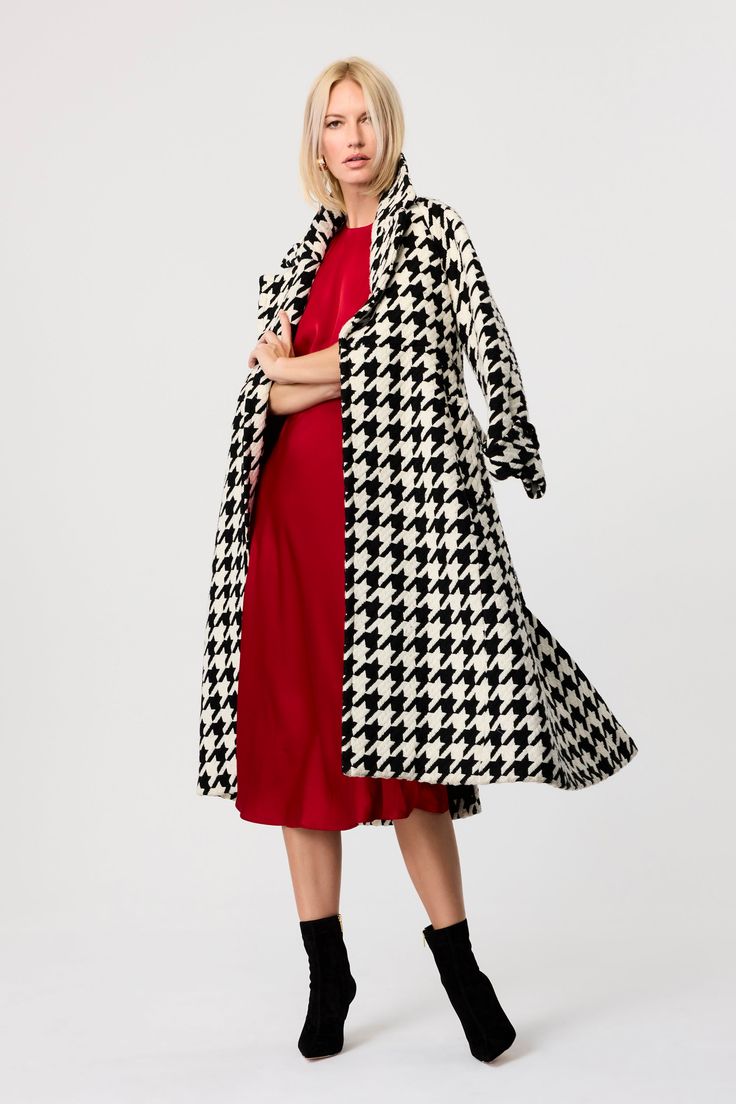 The bestselling Brandy coat is back with a bold new twist—houndstooth. Crafted from a woven fabric, this long trench jacket offers a heavier weight, perfect for cooler days. Its tailored fit allows for easy layering over chunky sweaters while maintaining a sleek silhouette. Design details include classic lapels, functional pockets, and a sash closure, making this houndstooth jacket both practical and stylish. Whether for work or weekend outings, the Brandy long trench jacket is a timeless additi Houndstooth Long Coat For Fall, Long Houndstooth Coat For Fall, Chic Houndstooth Long Sleeve Outerwear, Spring Wool Outerwear With Houndstooth Pattern, Chic Houndstooth Winter Outerwear, Plaid Houndstooth Outerwear For Spring, Spring Houndstooth Plaid Outerwear, Chic Plaid Long Coat, Chic Long Coat With Houndstooth Pattern