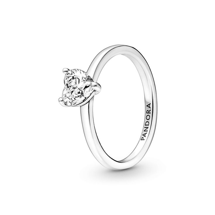 The latest addition to our solitaire collection, the Sparkling Heart Solitaire Ring features a heart-shaped clear cubic zirconia as the centerpiece. The Pandora logo is engraved on the inside of the polished shank. Stack this ring with other sterling silver pieces for a monochromatic look or mix metal finishes to make a unique statement. Classic White Gold Heart Ring With Solitaire, Classic Solitaire Heart Ring In White Gold, Classic Solitaire Heart Ring With Cubic Zirconia, Classic Heart Ring With Brilliant Cut, Classic Sterling Silver Heart Ring With Brilliant Cut, Pandora Stackable Rings, Heart Solitaire Ring, Chanel Wallpaper, Cute Promise Rings