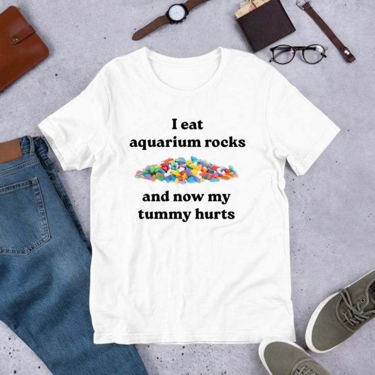 I Eat Aquarium Rocks, Funny Meme Shirt, Ironic Shirt, Oddly Specific Shirt Discover Our Latest Collection Of Versatile And Stylish T-Shirts (Gildan 5000), Where Fashion Meets Ultimate Comfort! Offered In Sizes Ranging From S To 3xl And A Vibrant Spectrum Of Colors Including Black, White, Sand, Green, Sport Grey, Red, Navy, And More, There's An Option To Cater To Every Taste. Crafted With Expertise Using Premium Materials, Our T-Shirts Provide A Luxurious Sensation And An Impeccable Fit That Last Bad Shirts Funny, Unhinged Tee Shirts, Unhinged T Shirts, Weird Shirts Graphic Tees, Cute Shirt Designs Aesthetic, Cringey Shirts, Cursed T Shirts, Oddly Specific Shirts, Ironic Tshirt