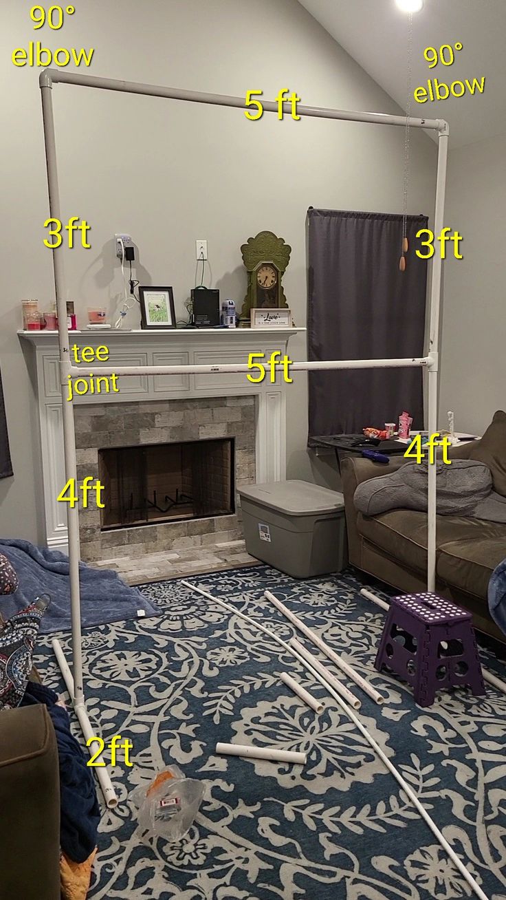 a living room with a fireplace and various measurements for the space in front of it