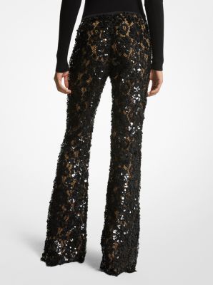 Intricately tailored in floral lace with nude silk lining these trousers are an ultra-romantic upgrade to basic flares. Featuring elaborate paillette hand-embroidery they’re designed with a concealed side-zip fastening and scalloped hem. Wear yours with a coordinating tunic or a shoulder-baring blouse. Chic Lace Evening Bottoms, Chic Lace Bottoms For Evening, Fitted Embellished Pants For Fall, Chic Embellished Bottoms For Wedding, Chic Embellished Wedding Bottoms, Spring Evening Lace Bottoms, Luxury Full-length Bottoms For Party, Luxury Full-length Party Bottoms, Luxury Sequined Pants For Evening