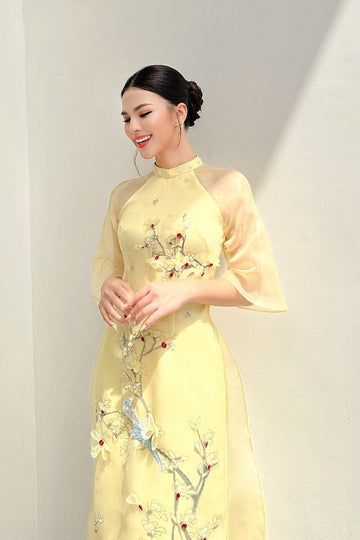 Hy Vien Middle Sleeves Ao Dai | MEAN BLVD Fitted Organza Dress For Spring, Fitted Organza Spring Dress, Elegant Spring Embroidered Wedding Dress, Elegant Spring Embroidered Floor-length Dress, Spring Evening Silk Embroidered Dress, Sheer Long Wedding Dress, Summer Fitted Organza Embroidered Dress, Long Sheer Wedding Dress, Summer Organza Embroidered Fitted Dress