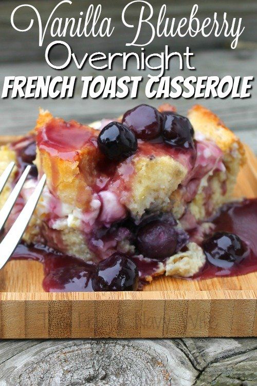 vanilla blueberry overnight french toast casserole on a cutting board with a fork