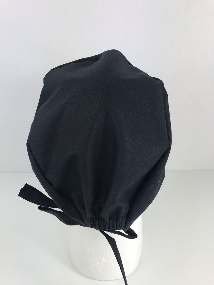 Simple, streamlined, and comfortable Skull Cap design! This classic style accommodates short to medium length of hair. Made out of 100% cotton. Cap size is standard. Cap has an elastic on the back for size adjustment Foldable trim allows for depth adjustment. Adjustable Black Hat With Cotton Sweatband, Cotton Bonnet Cap, Fitted Black Cotton Hats, Fitted Solid Cotton Hats, Fitted Cotton Hats In Solid Color, Fitted Cotton Hat In Solid Color, Fitted Solid Color Cotton Hats, Black Casual Bonnet With Adjustable Fit, Black Cotton Hat, One Size Fits Most