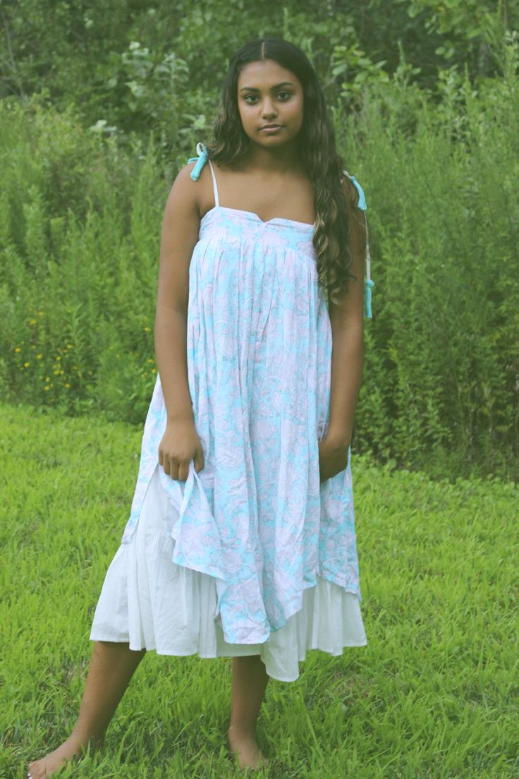 This dress is a boho dream. Embrace the slow craft of our nature inspired handblock printed hemp and bamboo dress, dyed with organic love. The organic cotton lining of the dress adds to flow and gives a ruffled accent around the edges of the dress and pockets. The print is created using organic dyes and hand carved wooden blocks by the artisans of Jaipur, India. The garment is sewn by women of Sewing the Seeds social enterprise. Hand crafted in India Relaxed Cotton Dress For Garden Party, Relaxed Fit Cotton Dress For Garden Party, Breezy Cotton Flowy Sundress, Breezy Cotton Sundress With Flowy Fit, Flowy Cotton Breezy Sundress, Spring Flowy Dresses With Natural Dye, Flowy Spring Dresses With Natural Dye, Relaxed Fit Ruffle Dress For Beach, Relaxed Fit Ruffled Dress For The Beach