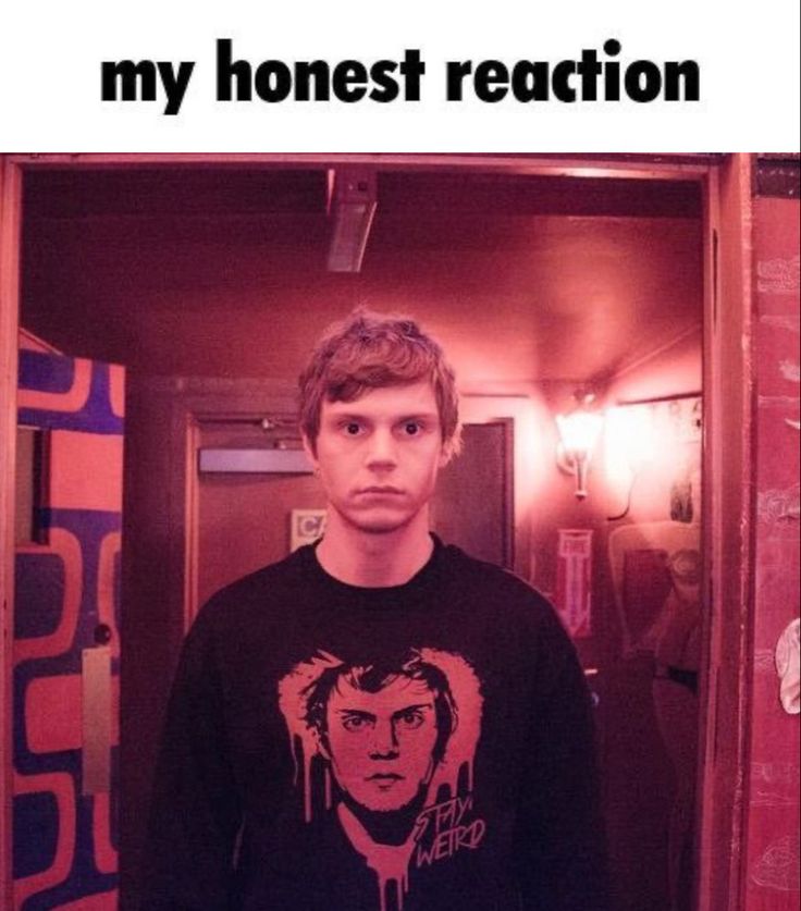 a man standing in front of a mirror wearing a shirt that says, my honest reaction