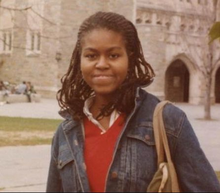 a young woman standing in front of a building