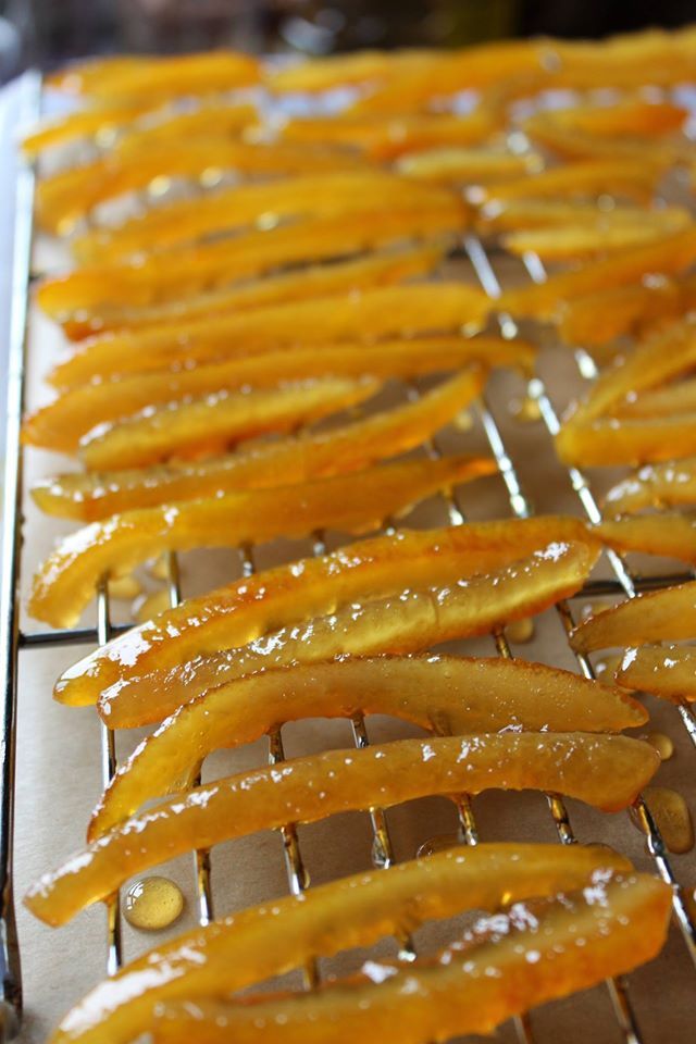 some food is being cooked on a metal rack with water droplets all over the edges