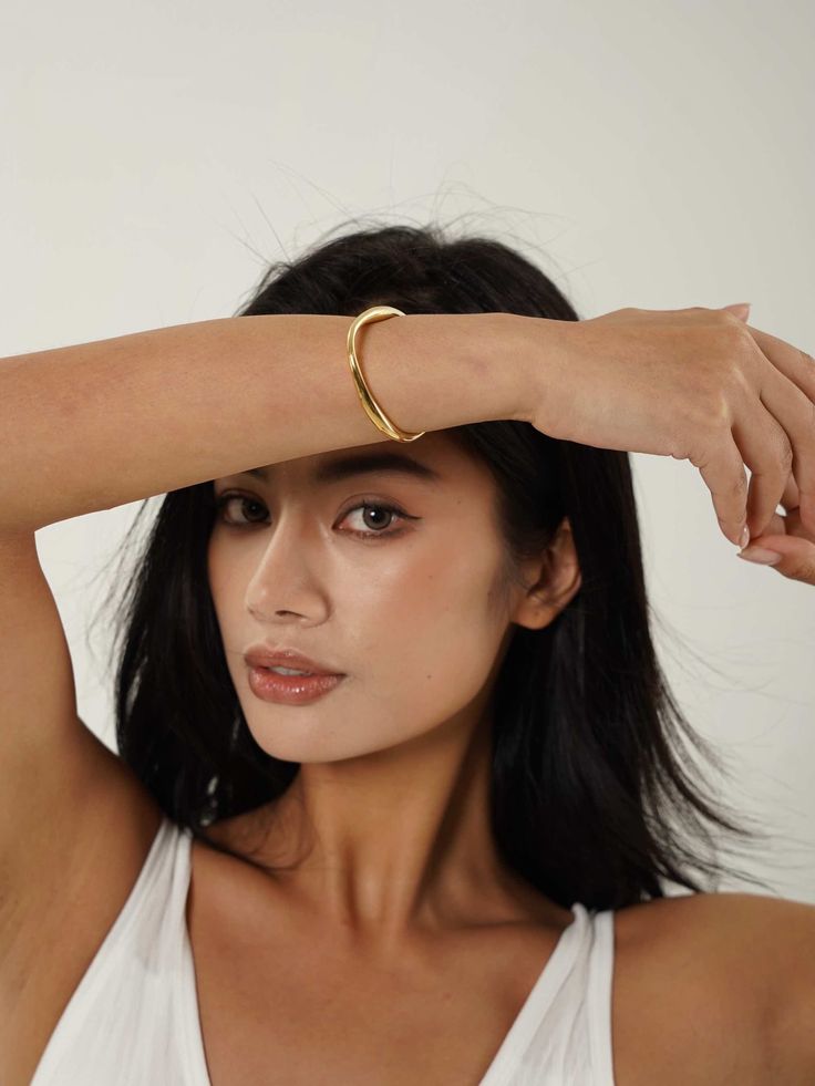 Discover the modern artistry of our Abstract Open Cuff Bracelet. Featuring a unique, flowing design, this bracelet blends contemporary style with effortless elegance. Gold Cuff Bangle, Chunky Gold Hoop Earrings, Open Cuff Bracelet, Flow Design, Herringbone Necklace, Rings And Bracelets, Gold Plated Bangles, Open Bangle, Gold Bracelet Cuff