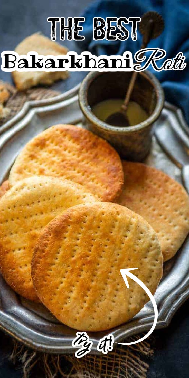 three crackers on a plate with dipping sauce