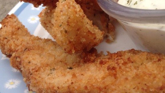 fried fish sticks and dip on a plate