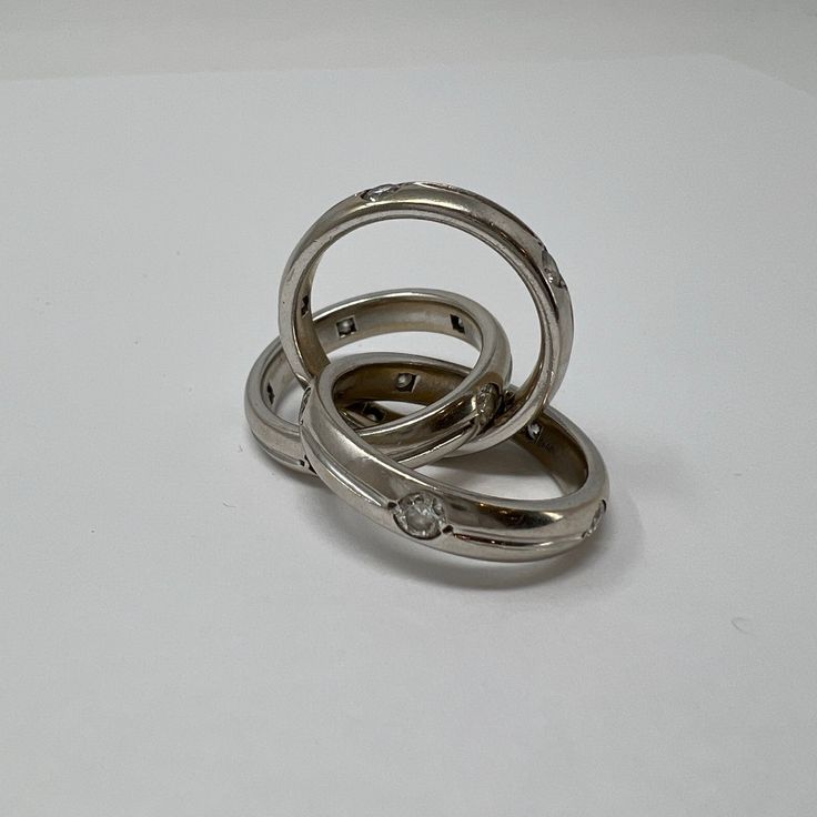 18K White Gold Rolling Rings with Diamonds (includes appraisal, Value:$13,000) Designer = Jewelry Size = 9 Material = 18K Gold Condition = Very Good Class = Premier Location: Glencoe Item Number: 12405-674 Item ID: 266939 Category: Ring Timeless White Gold Diamond Ring For Marriage, Polished Diamond Stackable Rings With Round Band, Luxury Formal Stackable Rings With Polished Finish, Designer Formal Diamond Ring With Single Cut Diamonds, Luxury Diamond Engraved Ring Hallmarked, Luxury Diamond Engraved Hallmarked Ring, Designer Formal Rings With Polished Finish, Luxury Hallmarked Diamond Engraved Ring, Designer Rings With Polished Finish For Formal Occasion