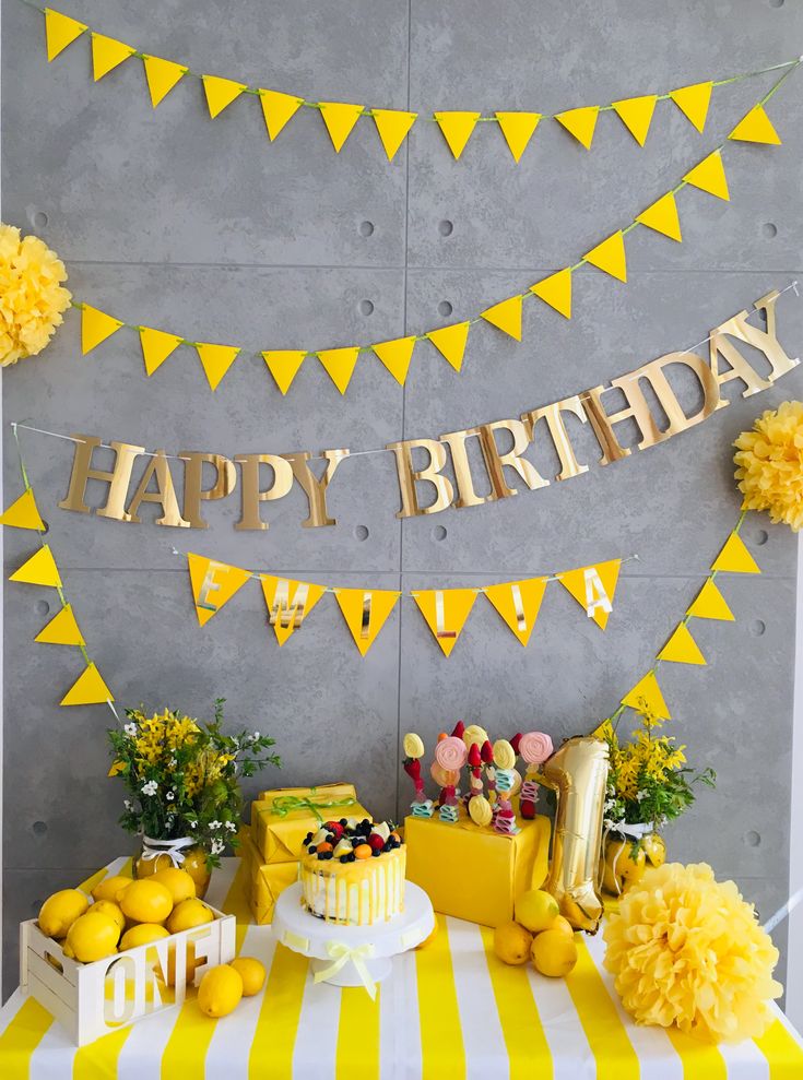 a birthday party with lemons, cake and decorations