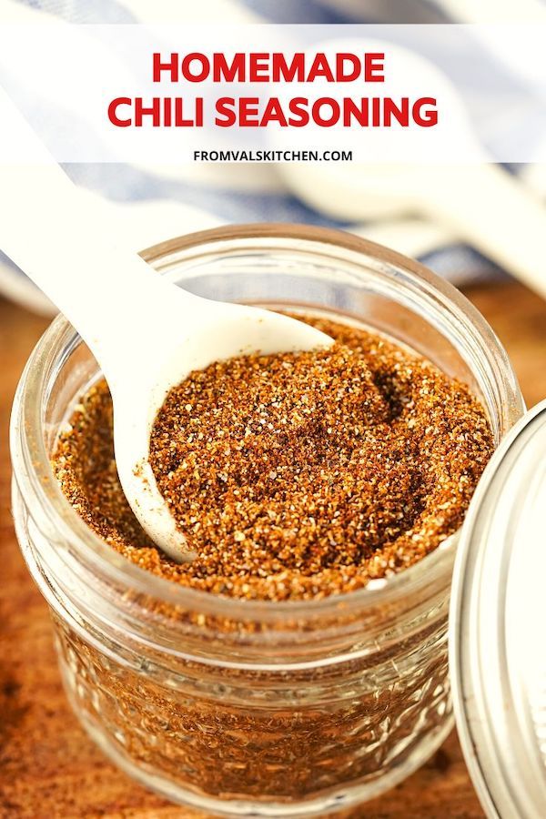 homemade chili seasoning in a glass jar with a spoon