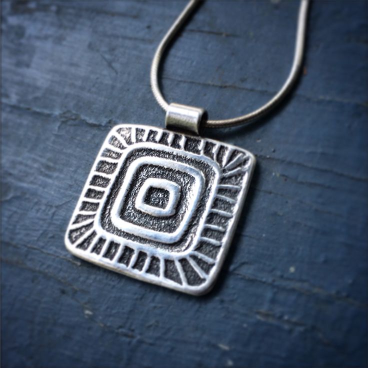 Samay is the Andean Kichwa word for a person’s unique vital energy. This pendant acts as a reminder of your Samay, the true essence of your being. Pendant is fine silver (999), approximately 1” x 1” and hangs on on a sterling silver chain. Free shipping on all orders within the USA! International orders flat rate of $8. It takes me approximately 10 days to create and ship your piece, as I hand-make each one. Silver Etched Square Pendant Necklace, Spiritual Sterling Silver Necklaces With Oxidized Finish, Spiritual Sterling Silver Necklace With Oxidized Finish, Sterling Silver Pendant Necklace For Meditation, Sterling Silver Etched Amulet Necklace, Silver Necklace With Large Square Pendant, Sterling Silver Engraved Necklaces For Meditation, Bohemian Silver Square Pendant Jewelry, Bohemian Silver Jewelry With Square Pendant