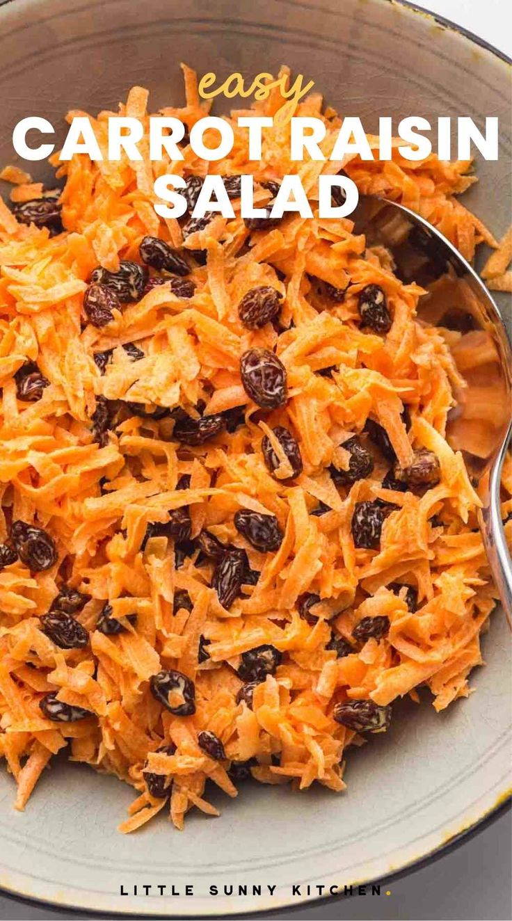 carrot raisin salad in a bowl with a spoon on the side that says easy carrot raisin salad