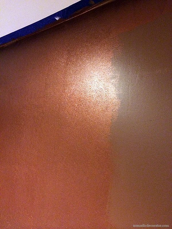 the wall is painted brown and white with blue trim