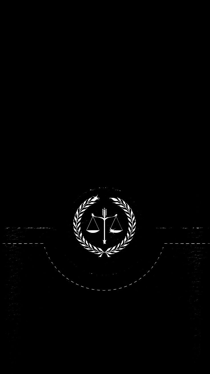 a black and white photo with the scales of justice on it's front cover