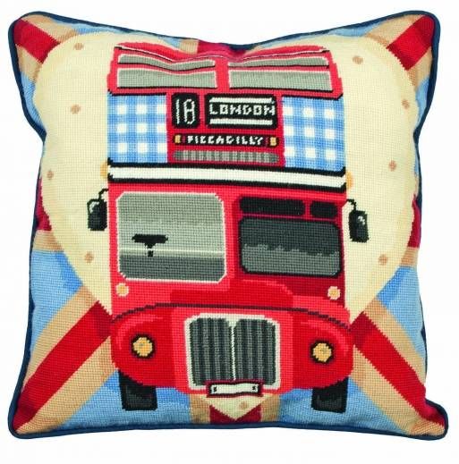 a red double decker bus pillow with blue trimmings on the front and sides