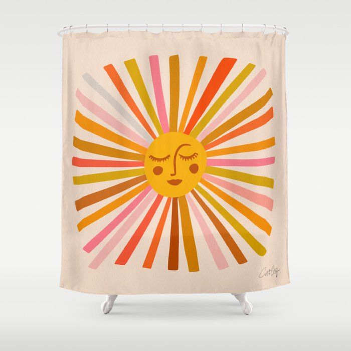 a shower curtain with an image of a sun on it