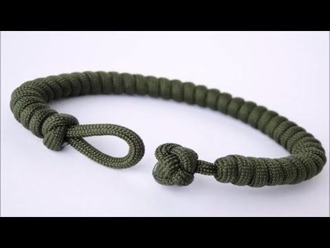 an army green rope bracelet with two knoted ends