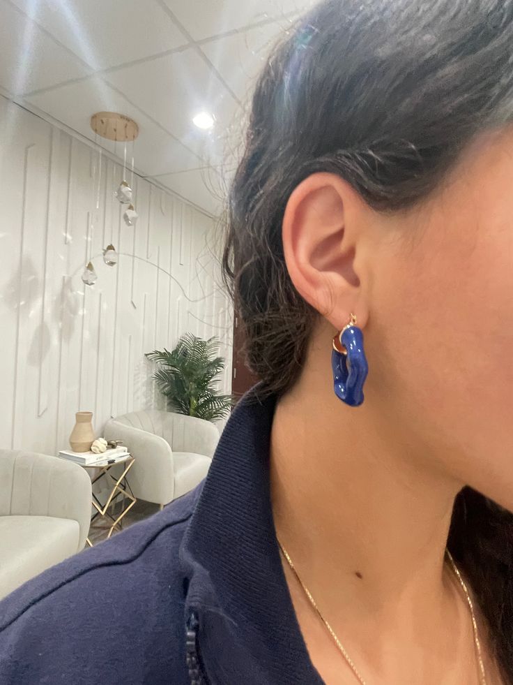 Amplify your earring collection with the Jarol Abstract Hoop. This unique stunner features a perfectly imperfect hoop in a beautiful royal blue. 1 1/2 " 18k plated with an enamel coating Made to last Water & tarnish resistant Trendy Blue Enamel Jewelry, Blue Hypoallergenic Hoop Jewelry, Hypoallergenic Blue Hoop Jewelry, Elegant Blue Hoop Earrings For Everyday, Everyday Blue Tarnish-resistant Jewelry, Modern Blue Hoop Jewelry, Elegant Blue Hypoallergenic Hoop Earrings, Elegant Hypoallergenic Blue Hoop Earrings, Modern Small Blue Hoop Earrings