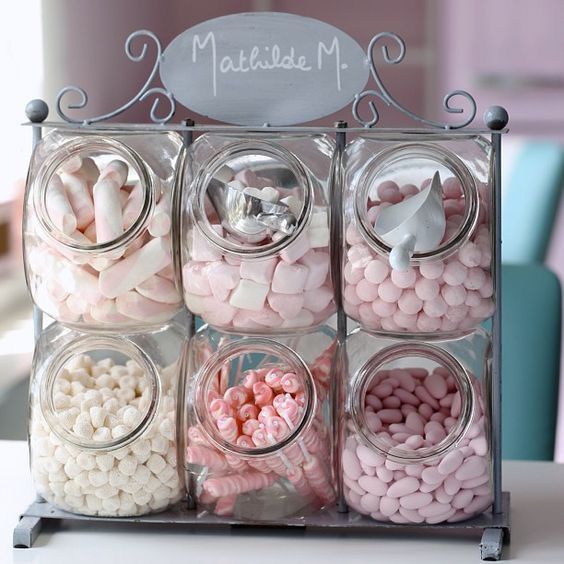 a container filled with lots of candy sitting on top of a table