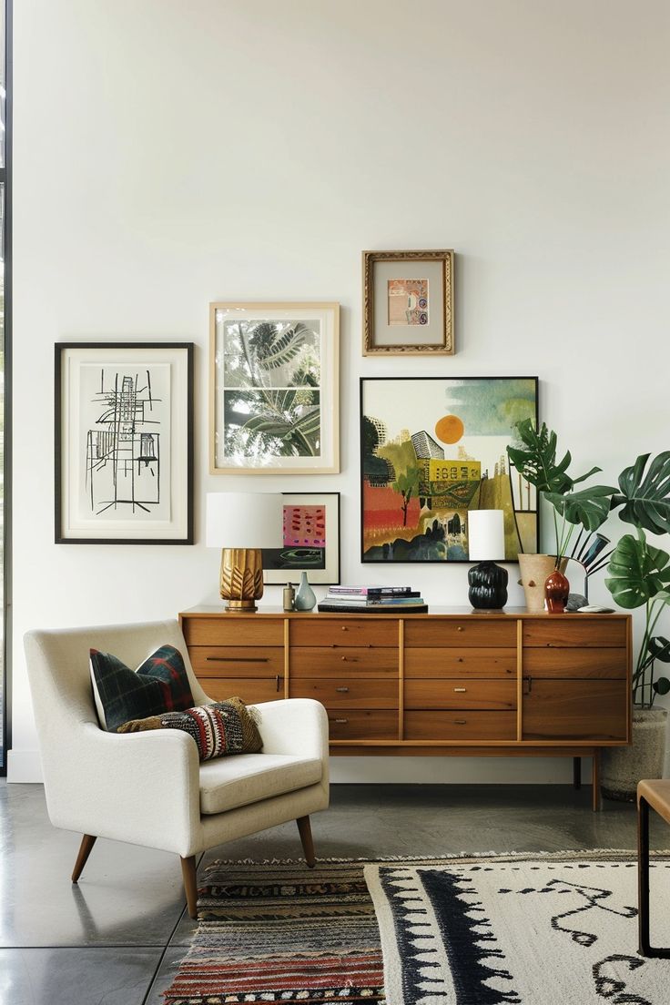 a living room filled with furniture and pictures on the wall